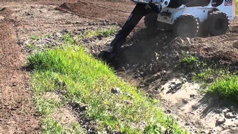 building mx track with skid steer|Skid Steer Attachments for Building a Motocross Track.